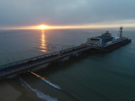 Aerial image of Bournemouth Pier with sunrise